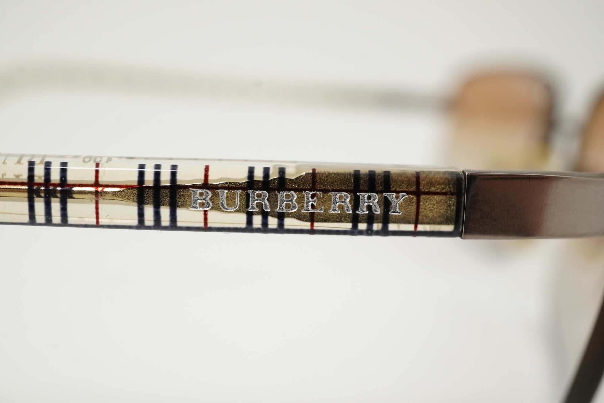 A Burberry brown tartan scarf, sunglasses with case and wallet with original box.